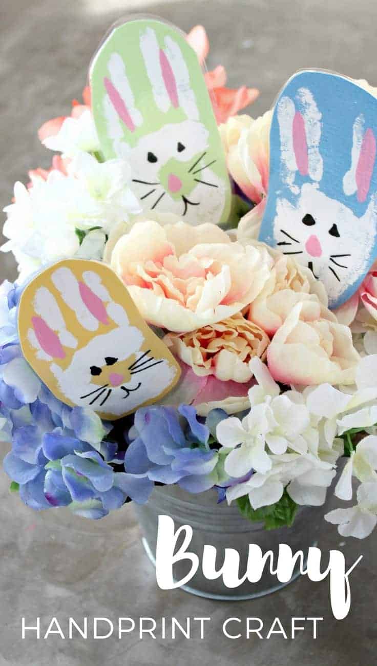 A close-up image of flowers with handmade bunny handprints