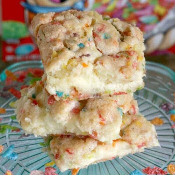Fruity pebble cookie cheesecake bars close up on a plate