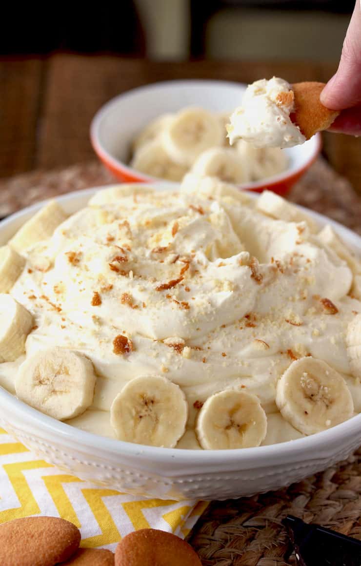 A close-up image a banana cream pie dip in a white bowl