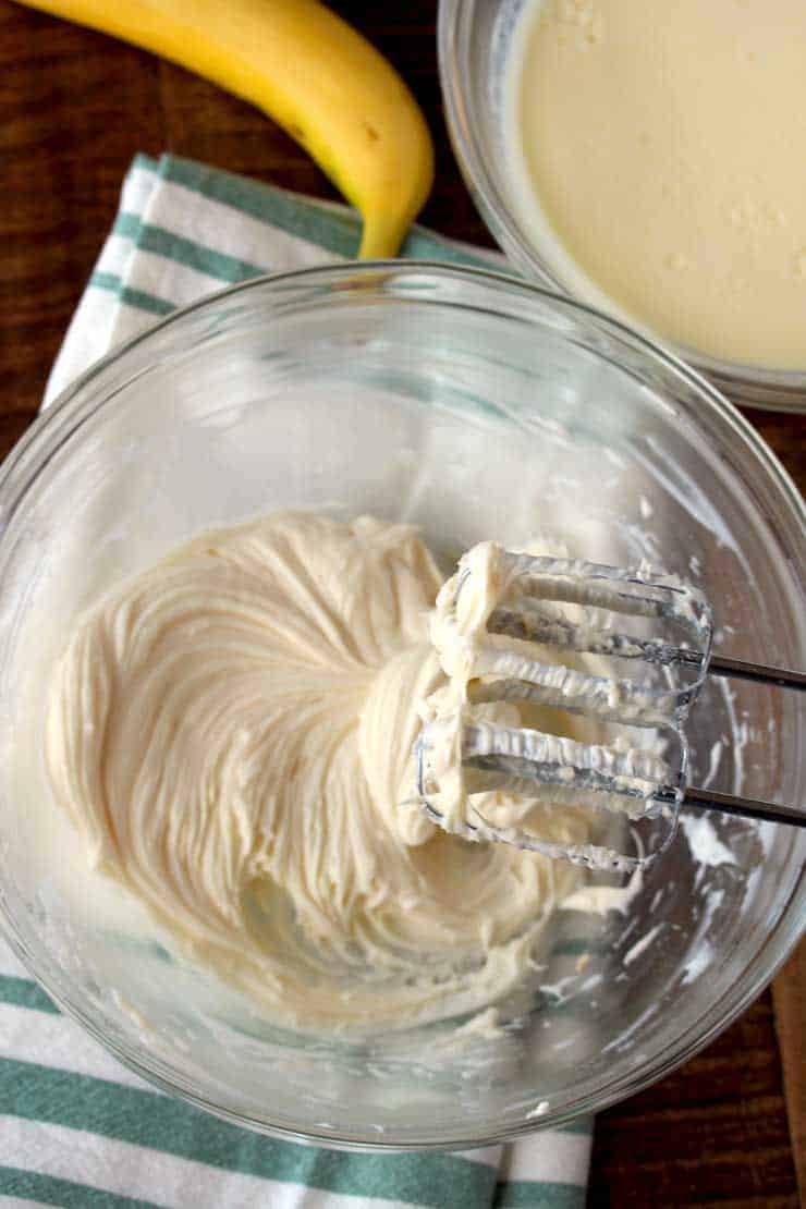 Banana cream pie dip in a glass bowl being blended