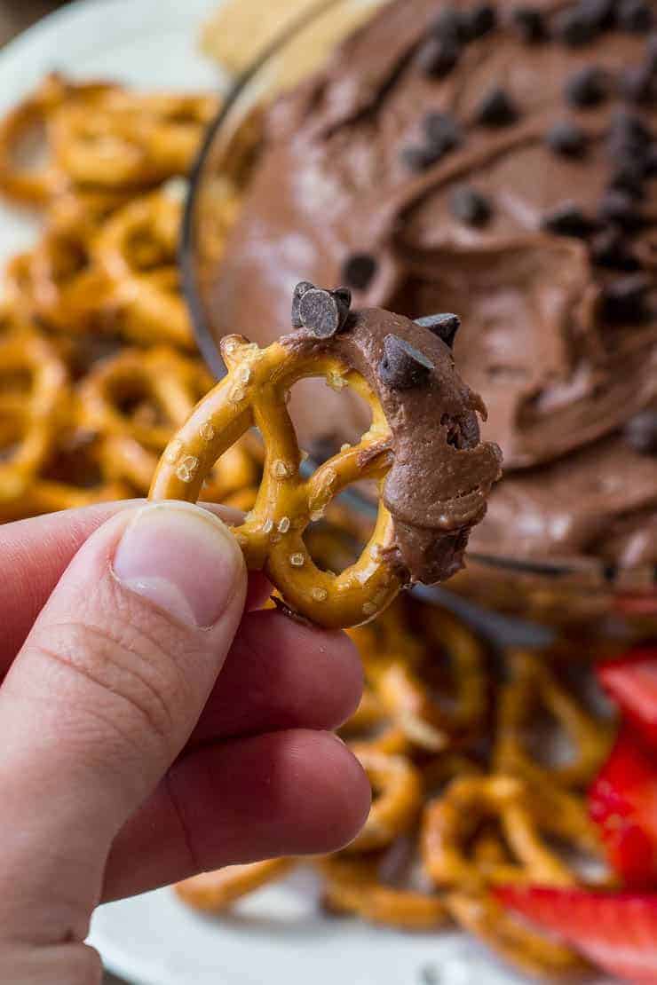 Easy brownie dip with a pretzel dipped in the batter