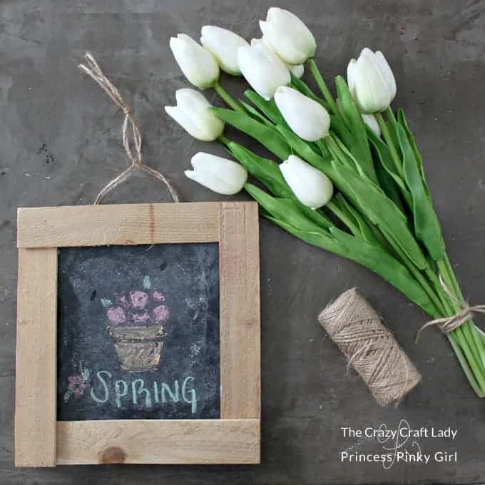 A close up of a flower And a DIY wood chalkboard frame