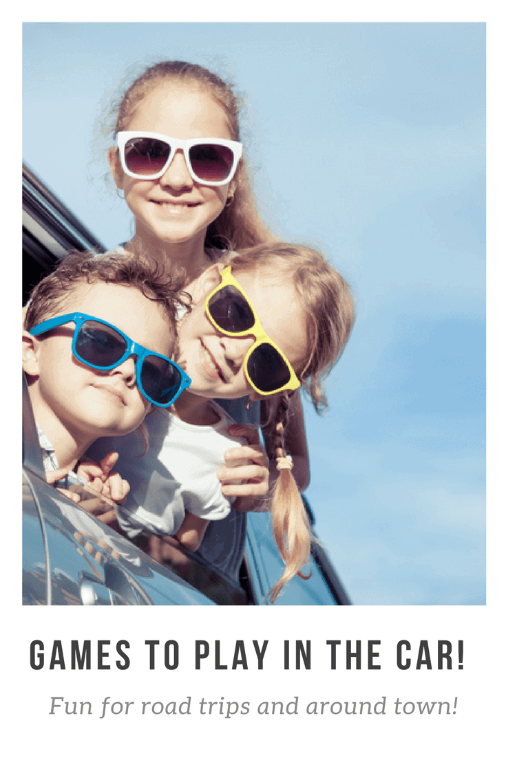 Close up of three kids with sunglasses on leaning their head out of a car window