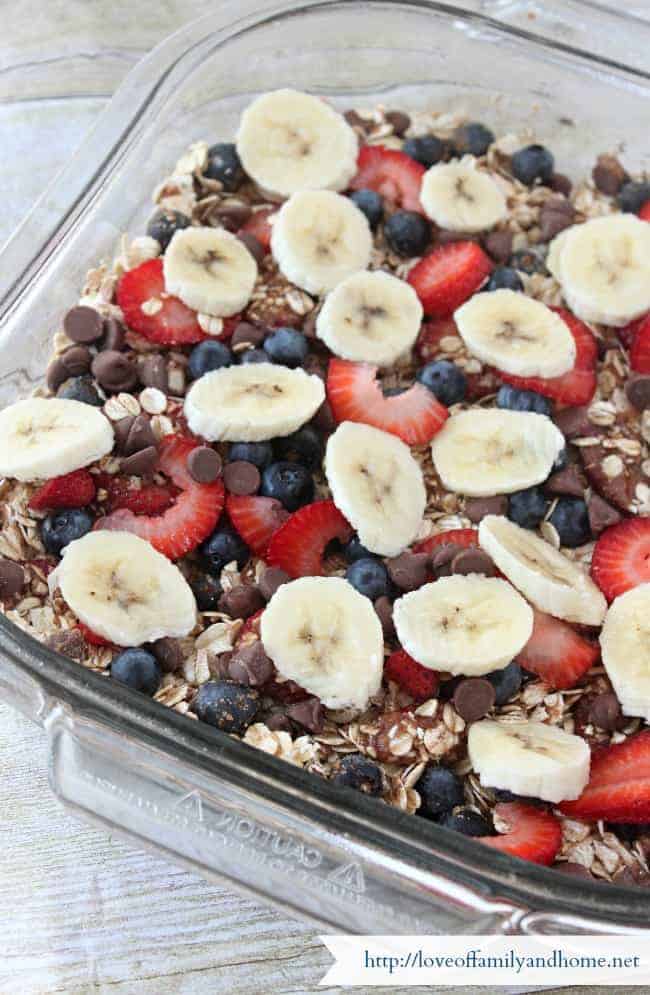 A close up of food, with Baked oatmeal with bananas strawberries and blueberries on top