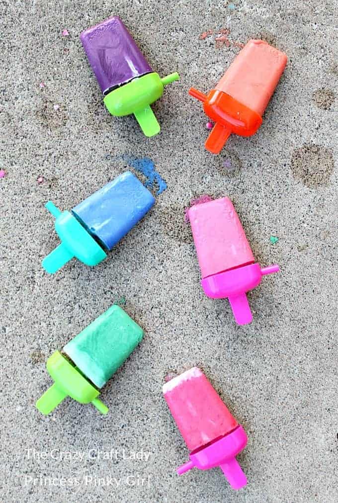 Sidewalk chalk in the shape of Popsicles in the driveway