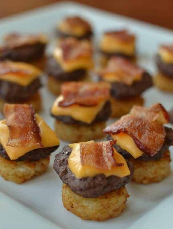 Mini bacon cheeseburgers and a white plate