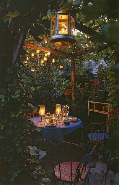 An outside table with candlelight and a covered top