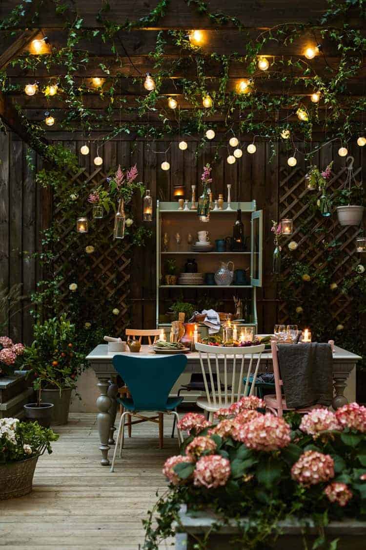 A room filled with furniture and vase of flowers on a table