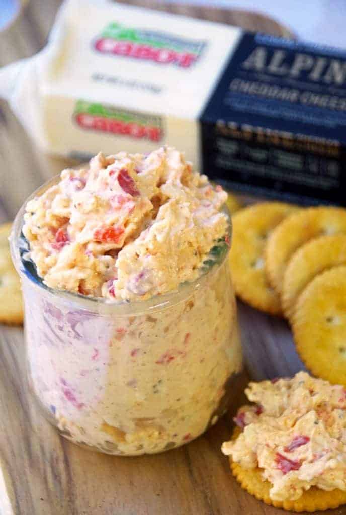 Pimento cheese dip in a glass with crackers