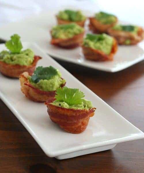 Mini bacon guacamole cups on a white plate