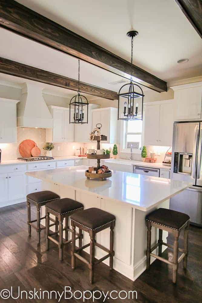 A kitchen with a table in a room