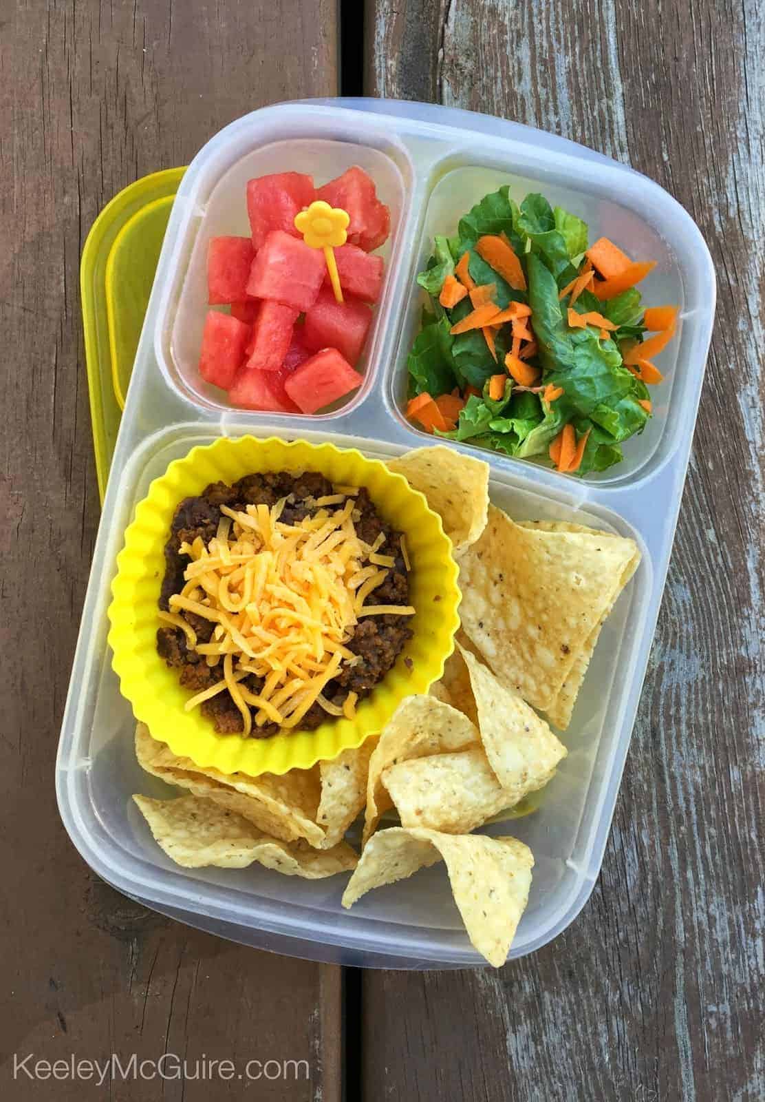 A plastic container of food, with Lunch and Sandwich