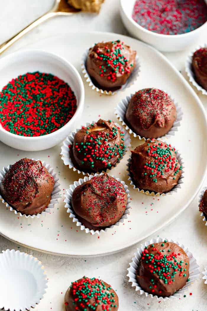 No bake peanut butter balls with sprinkles on a white plate