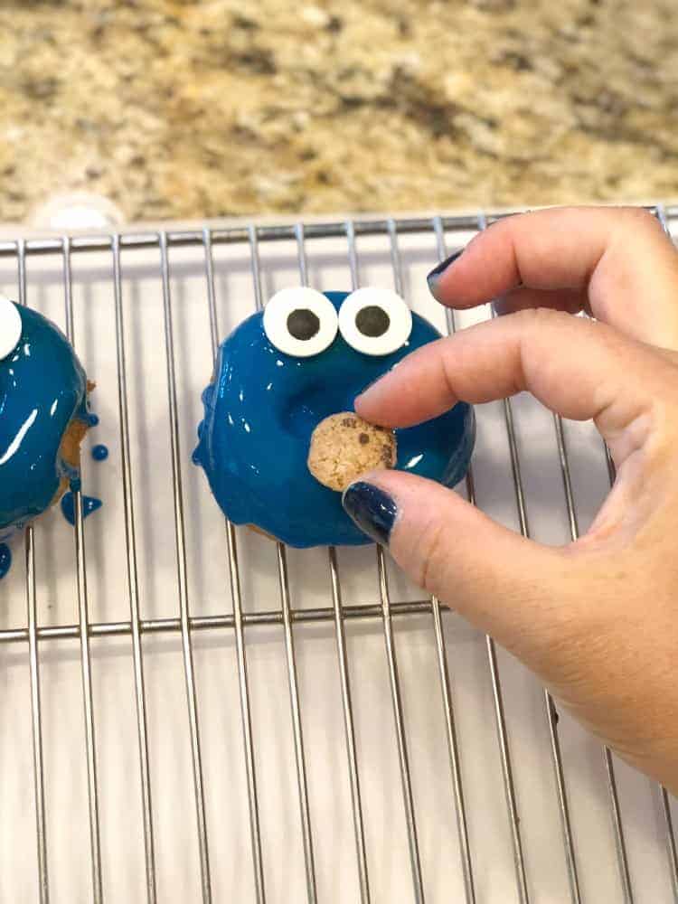 Place eyes and cookie on Cookie Monster mouth