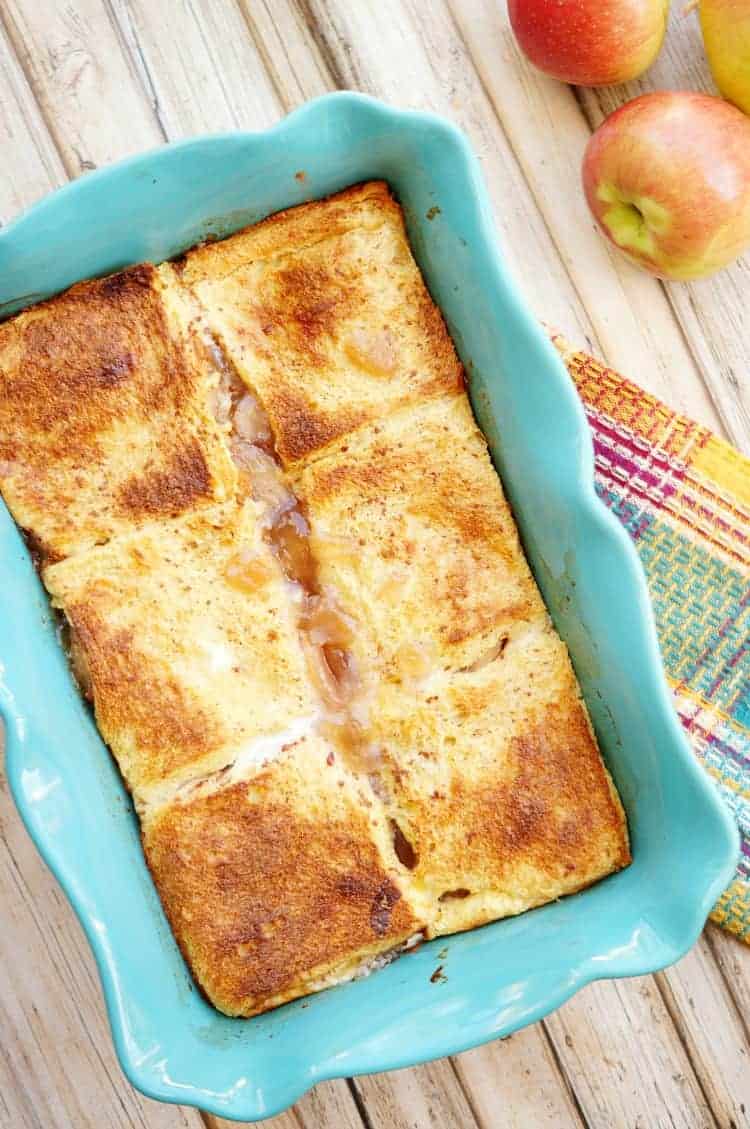 Apple pie French toast casserole and a blue casserole dish