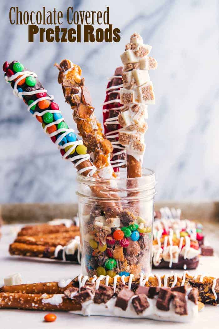 Chocolate covered pretzel rods covered in candy 