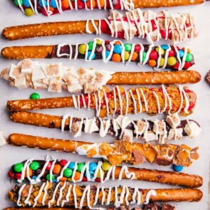 chocolate covered pretzel rods with candy chocolate on top