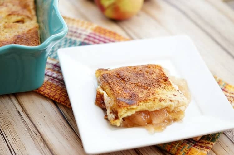 Overnight stuffed apple pie french toast slice on a white plate