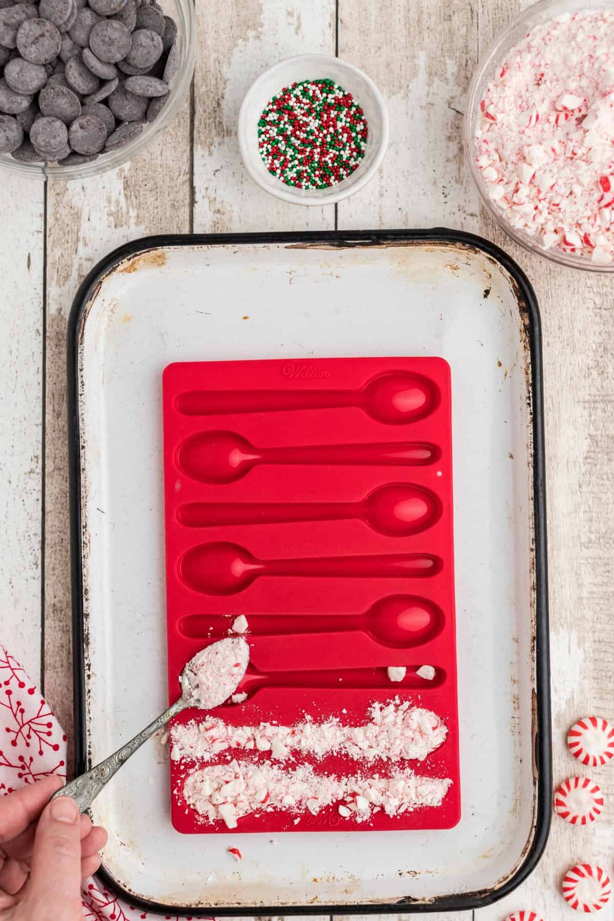 crushed peppermint in a red silicone spoon mold