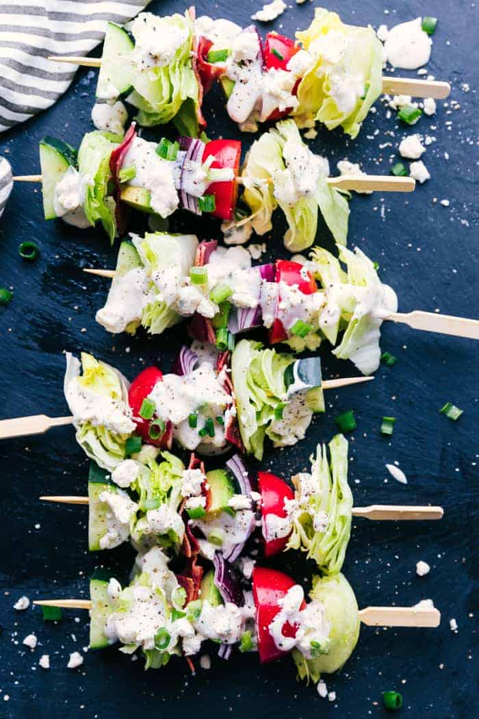 Wedge salad skewers on a black background