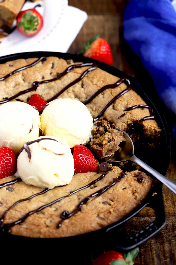 Skillet Cookie topped with ice cream and chocolate sauce.