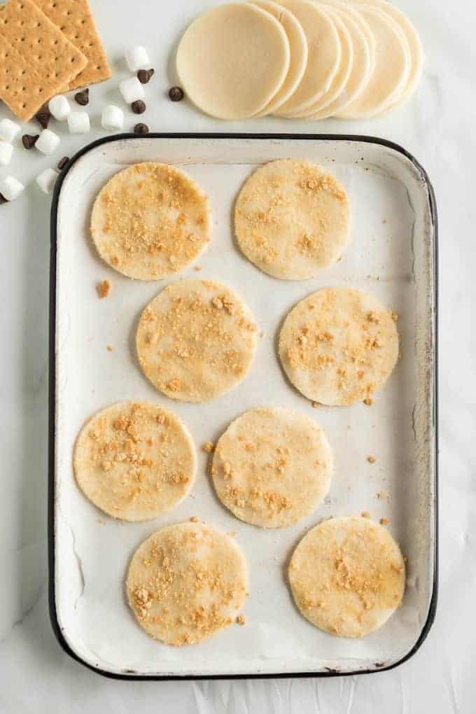 brush pie crust with butter and dip in graham cracker crust