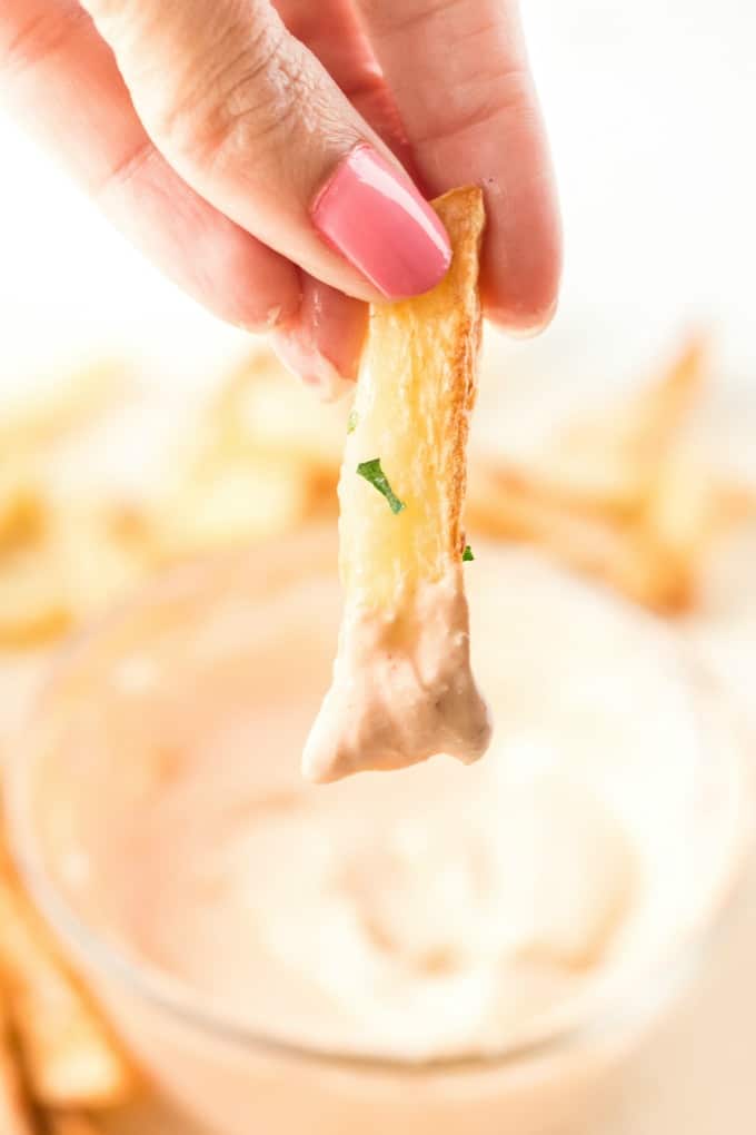 Air fried french fry dipped in buffalo dip