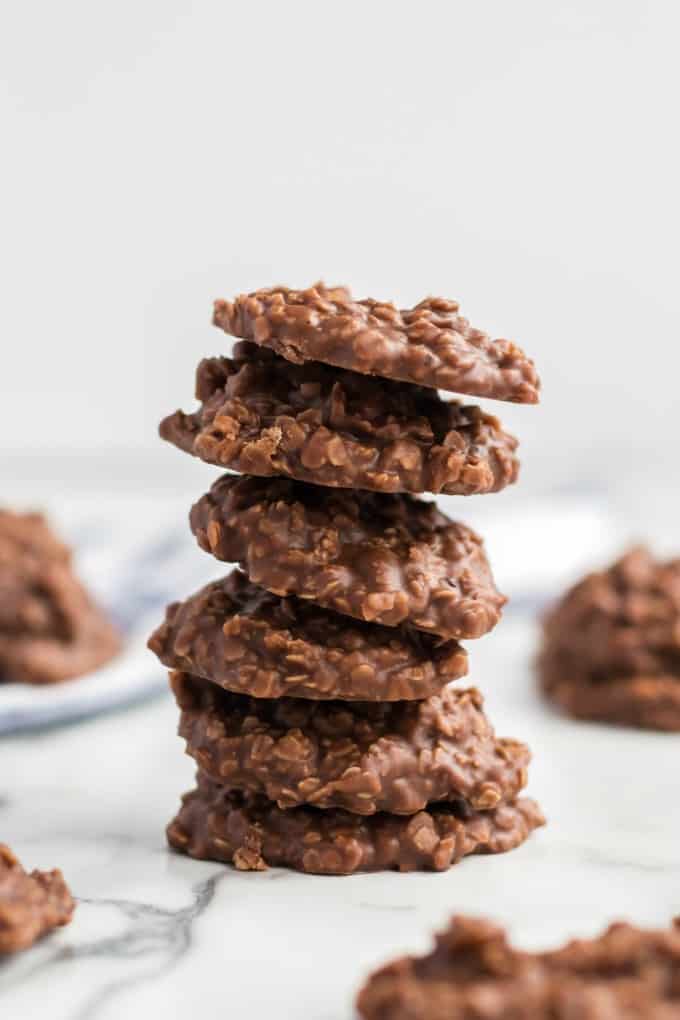 No Bake Chocolate Peanut Butter Cookies stacked on a marble table