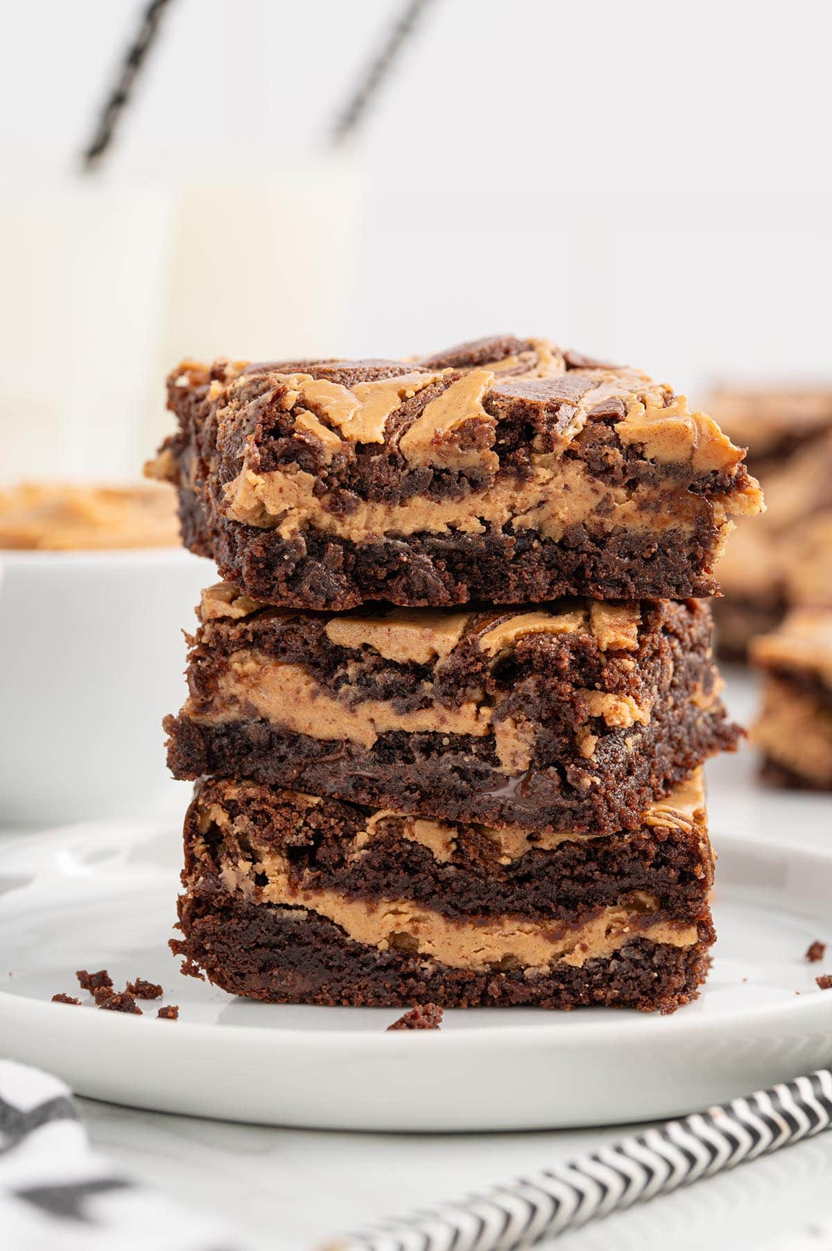 a stack of three peanut butter brownies on the plate.