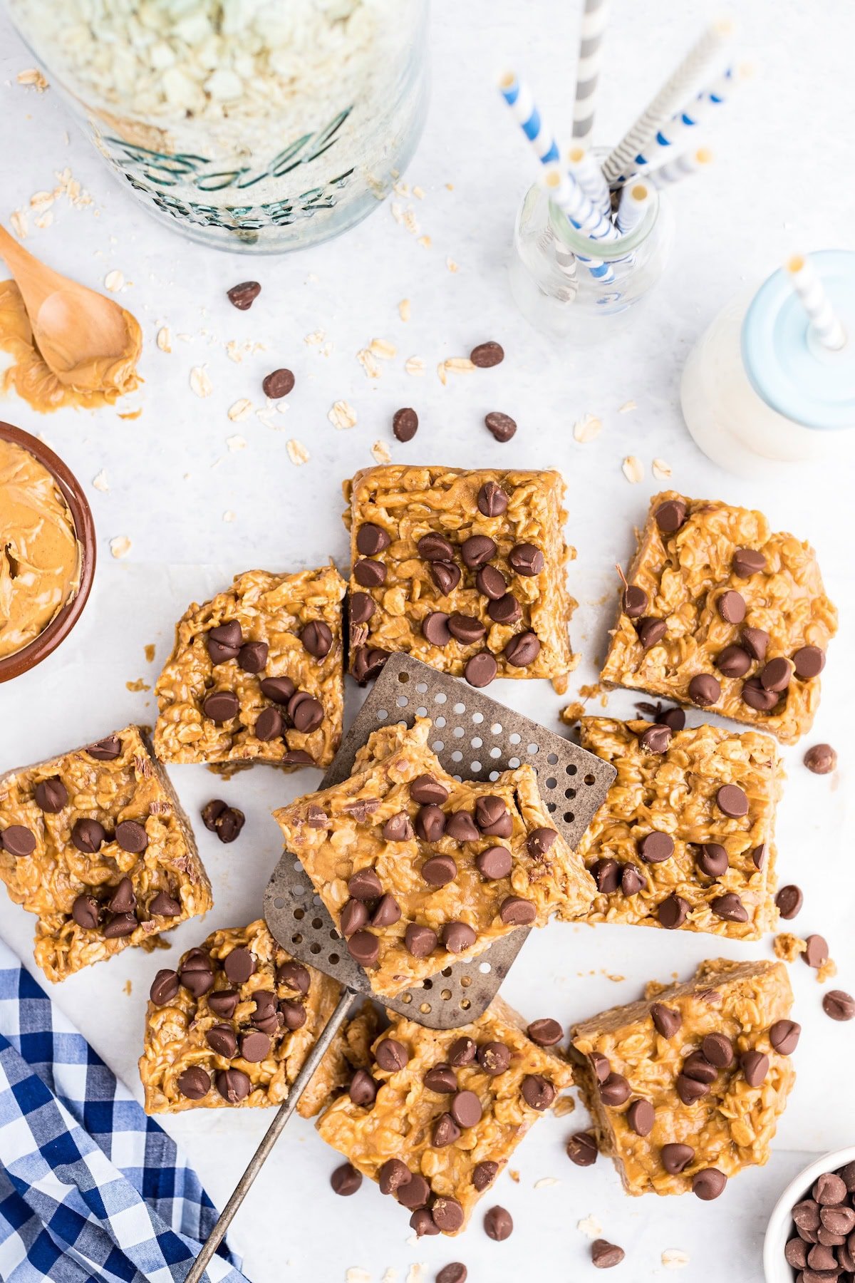 peanut butter oatmeal chocolate chip bars on top of table. 