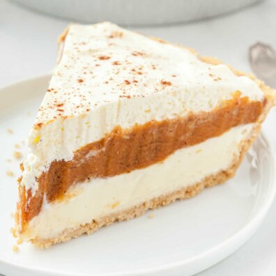 piece of pumpkin pie on a white plate