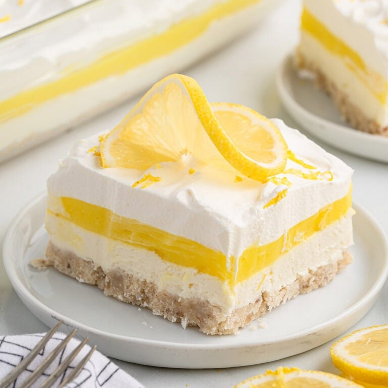 a slice of lemon lush dessert on the plate.