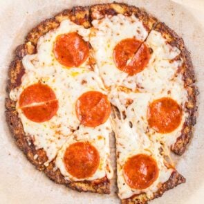 cauliflower pizza with pepperoni on top.
