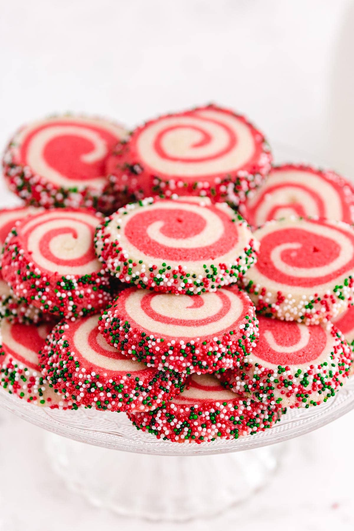 a couple of Christmas pinwheels cookies on top of the dessert platter.