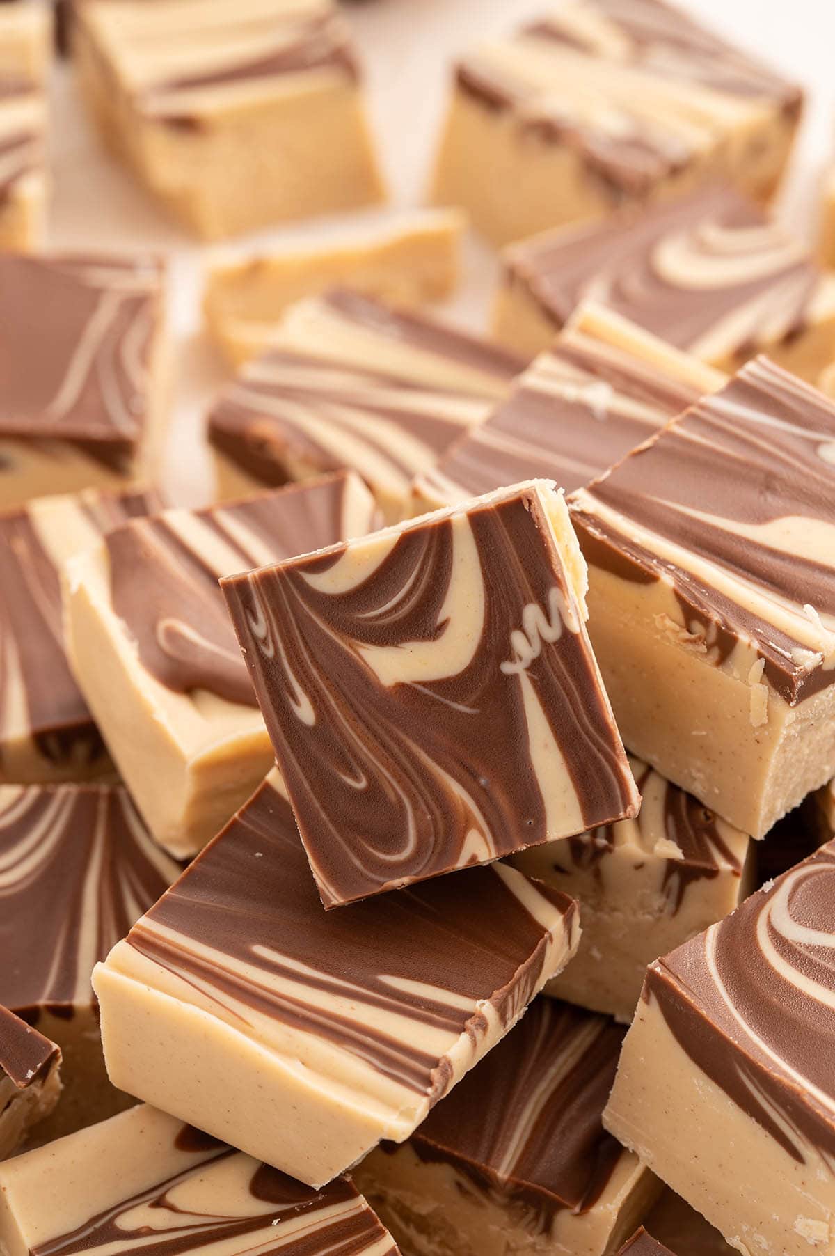 a couple of Tiger Butter Fudge with swirl design on the table.