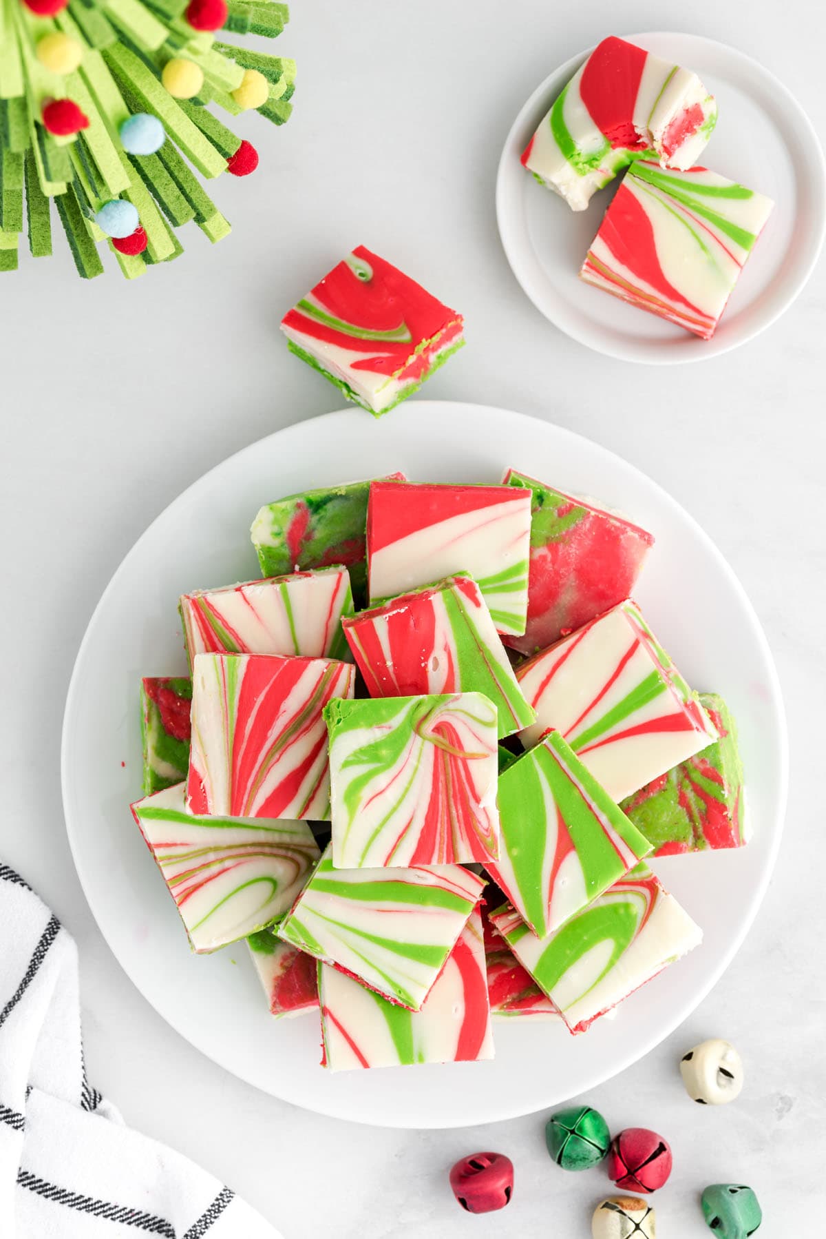 squares of christmas fudge on a plate. 