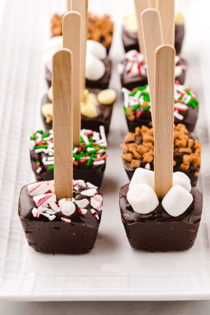 hot chocolate on a stick with toppings on plate
