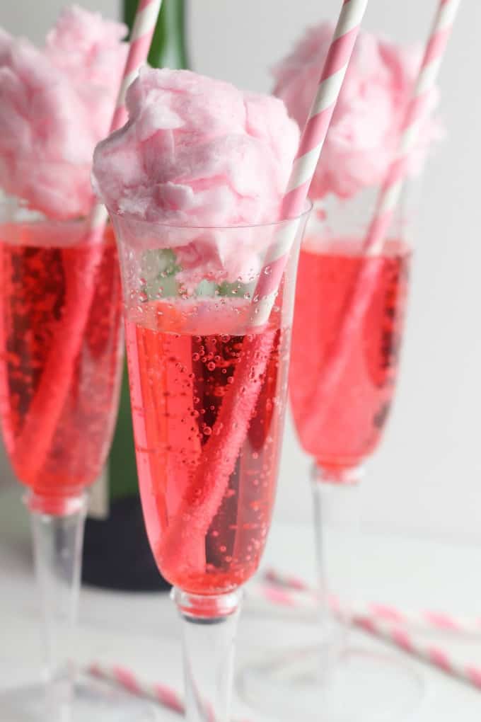 Champagne Cotton Candy Cocktail with pink and white straw