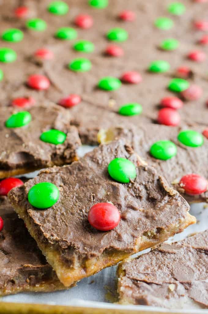 A close up of graham cracker toffee bark with red and green M&Ms