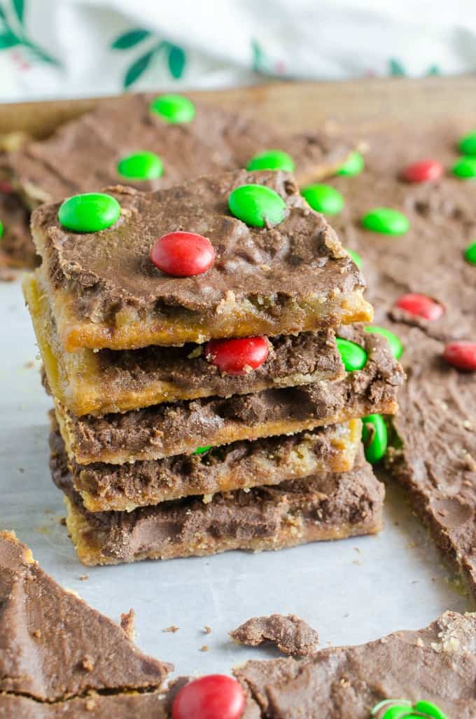A close up stacked up graham cracker toffee bark with red and green M&Ms