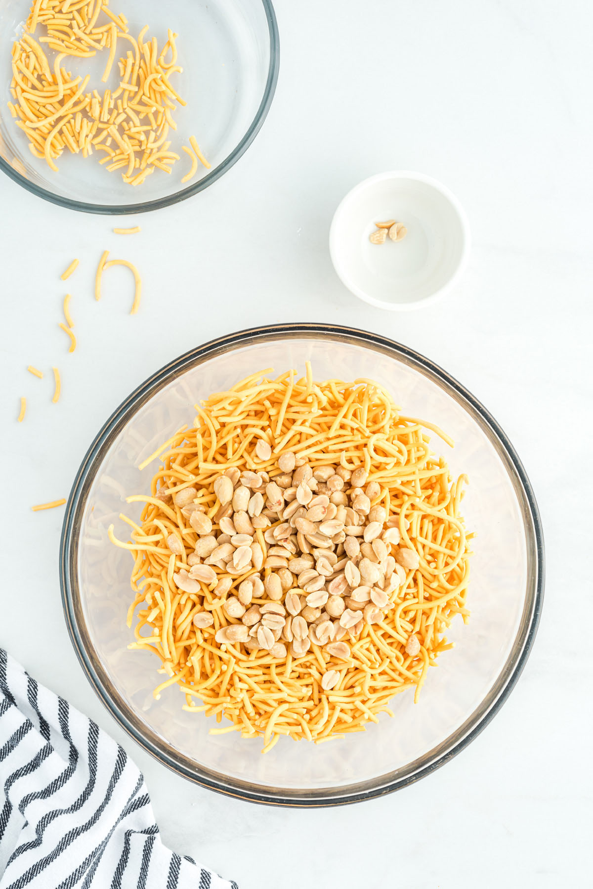peanuts and chow mein noodles in a large bowl
