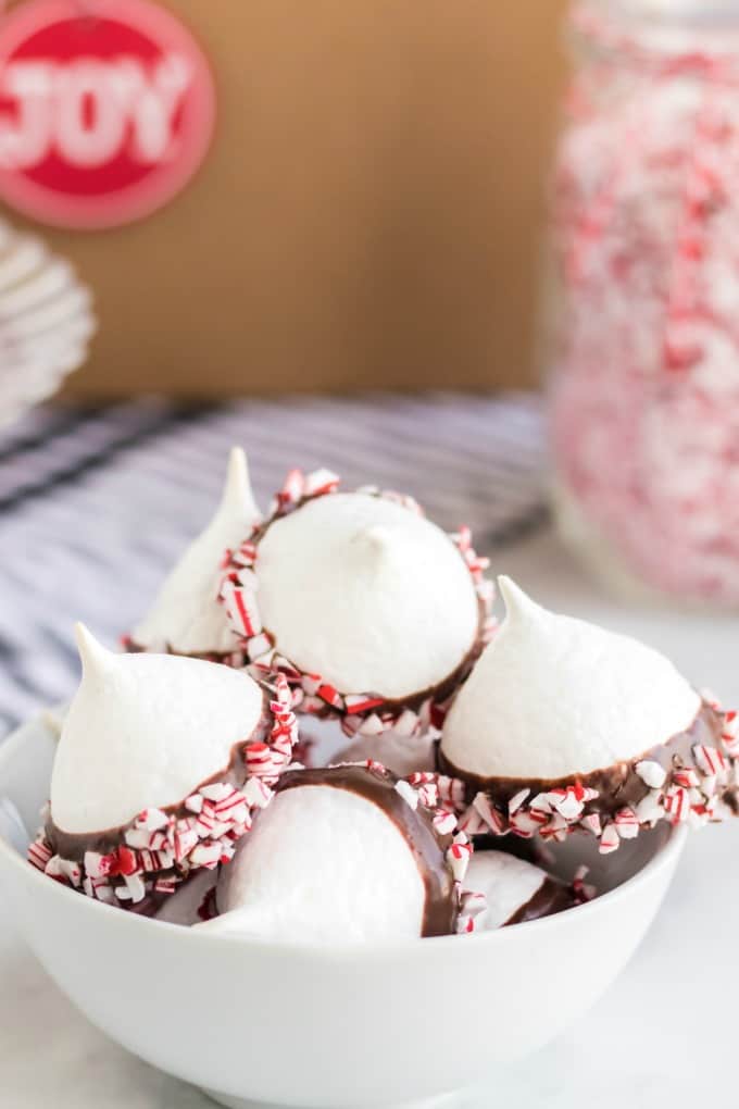 Chocolate Dipped Meringue Cookies in a white bowl