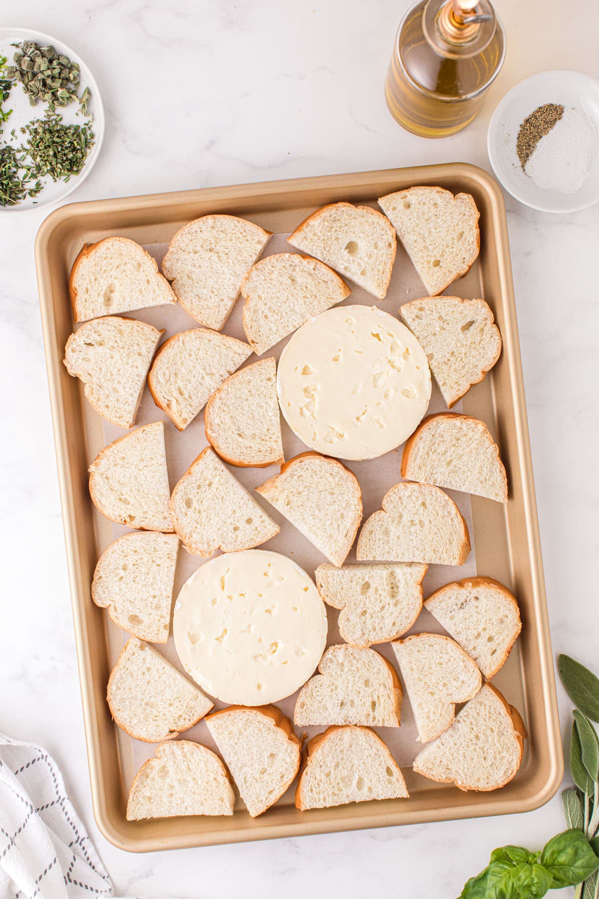 brie cheese and bread slices on baking tray