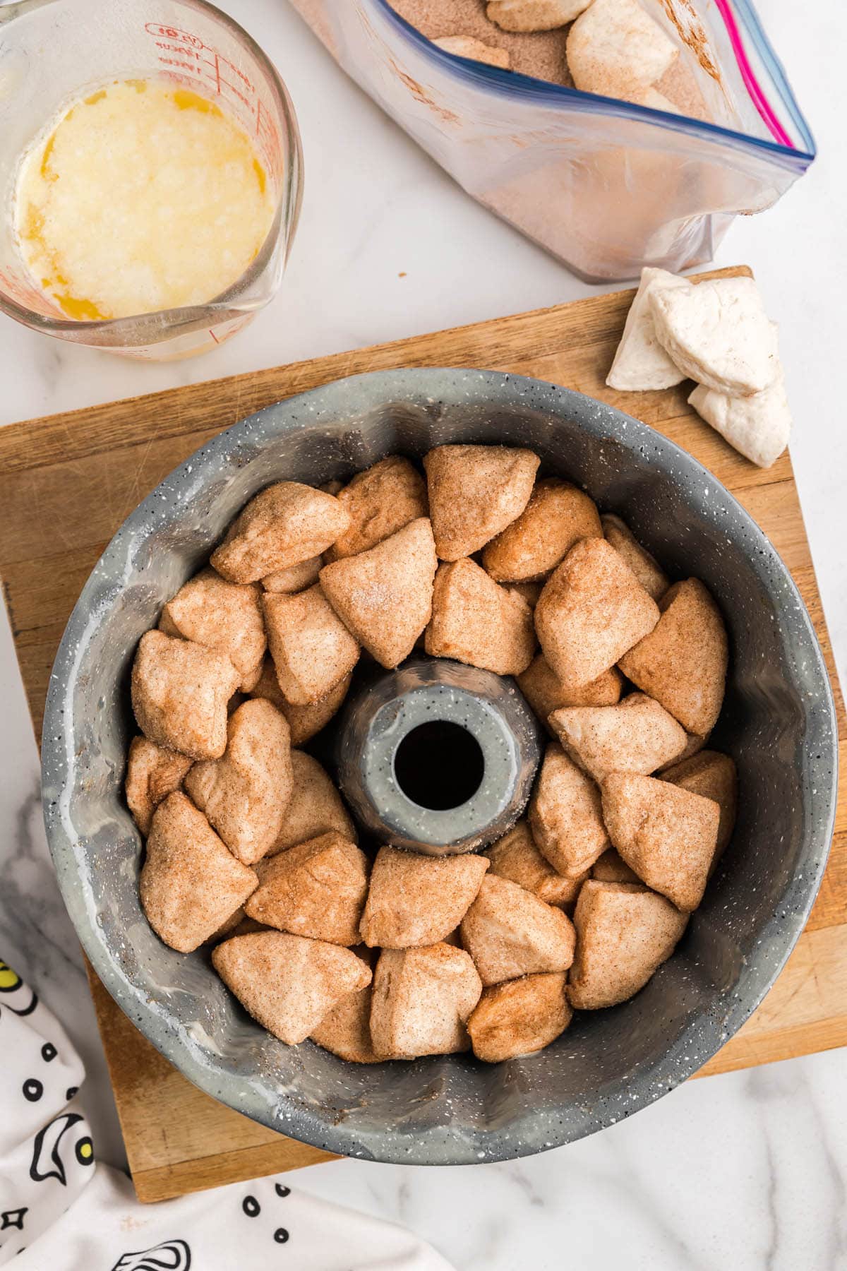 Place biscuit pieces into bundt pan.