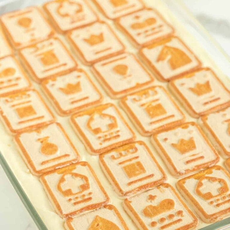 Vanilla wafer cookies arranged in a dish with decorative patterns.