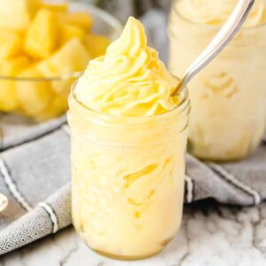 dole whip in a glass with a spoon square