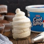 whipped cream in clear glass jar.