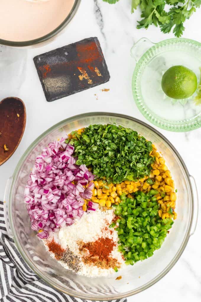 ingredients for corn salad in a glass bowl