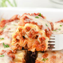 lasagna roll ups being lifted using spatula.