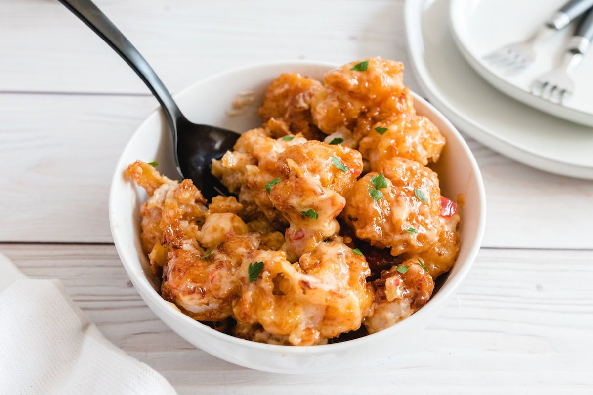 bang bang shrimp served in a white bowl. 